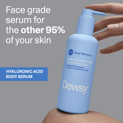 Hand holding Dewsy Down Deep HA Body Serum — face grade hyaluronic acid body serum for the other 95% of your skin
